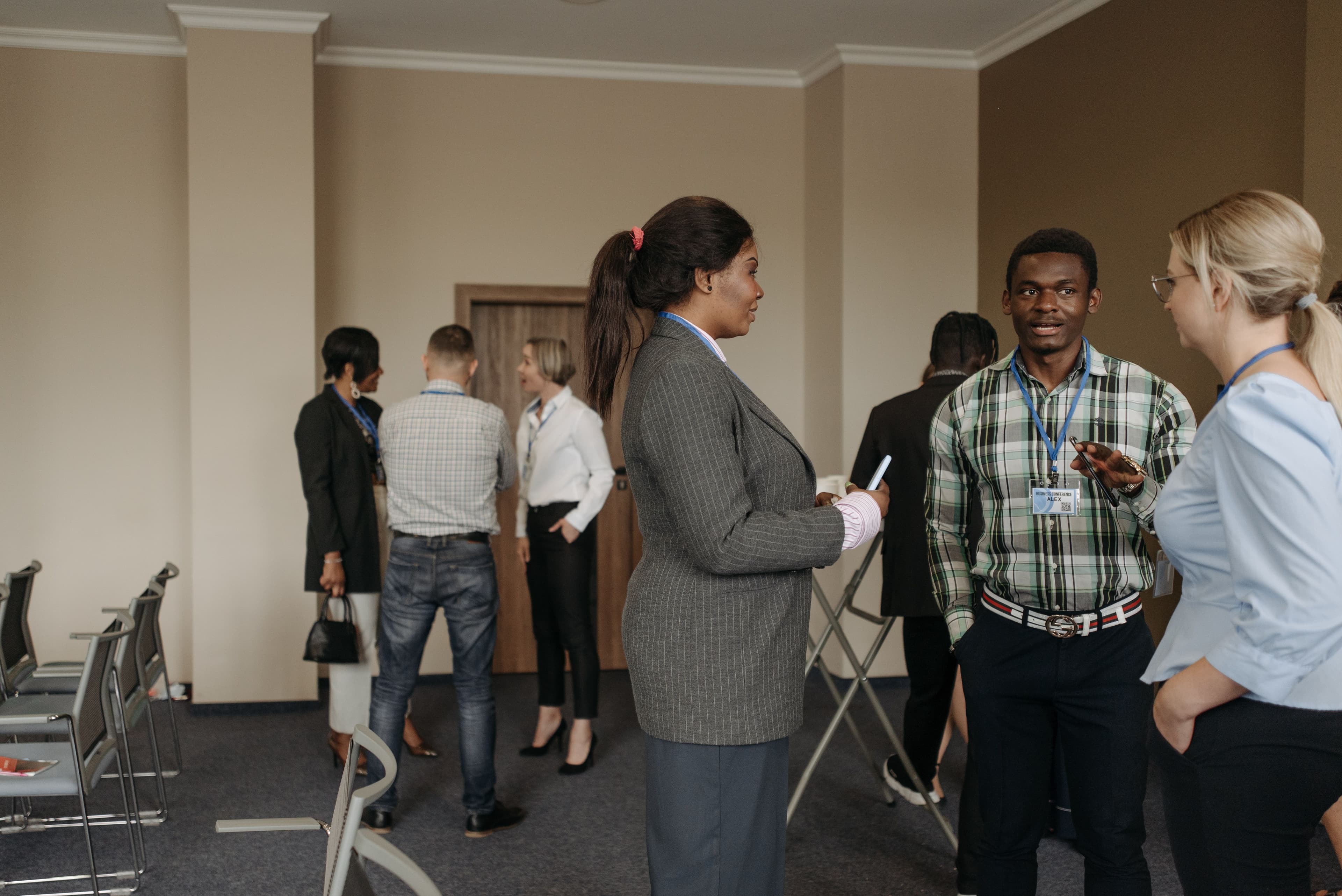 Professionals networking and exchanging contacts at a recruitment event